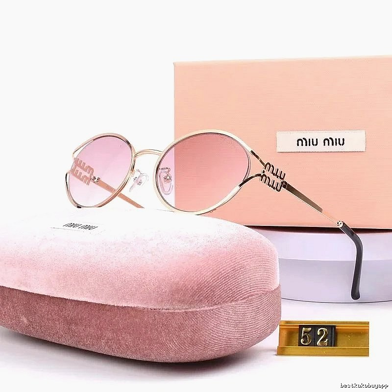 Miu Miu Statement Oversized sunglasses Black Oval Sunglasses for Easy Pairing