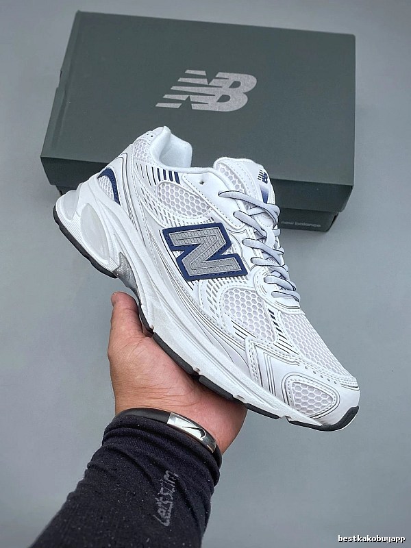 New Balance White and Navy Running Shoes Defined by Classic Running Profile